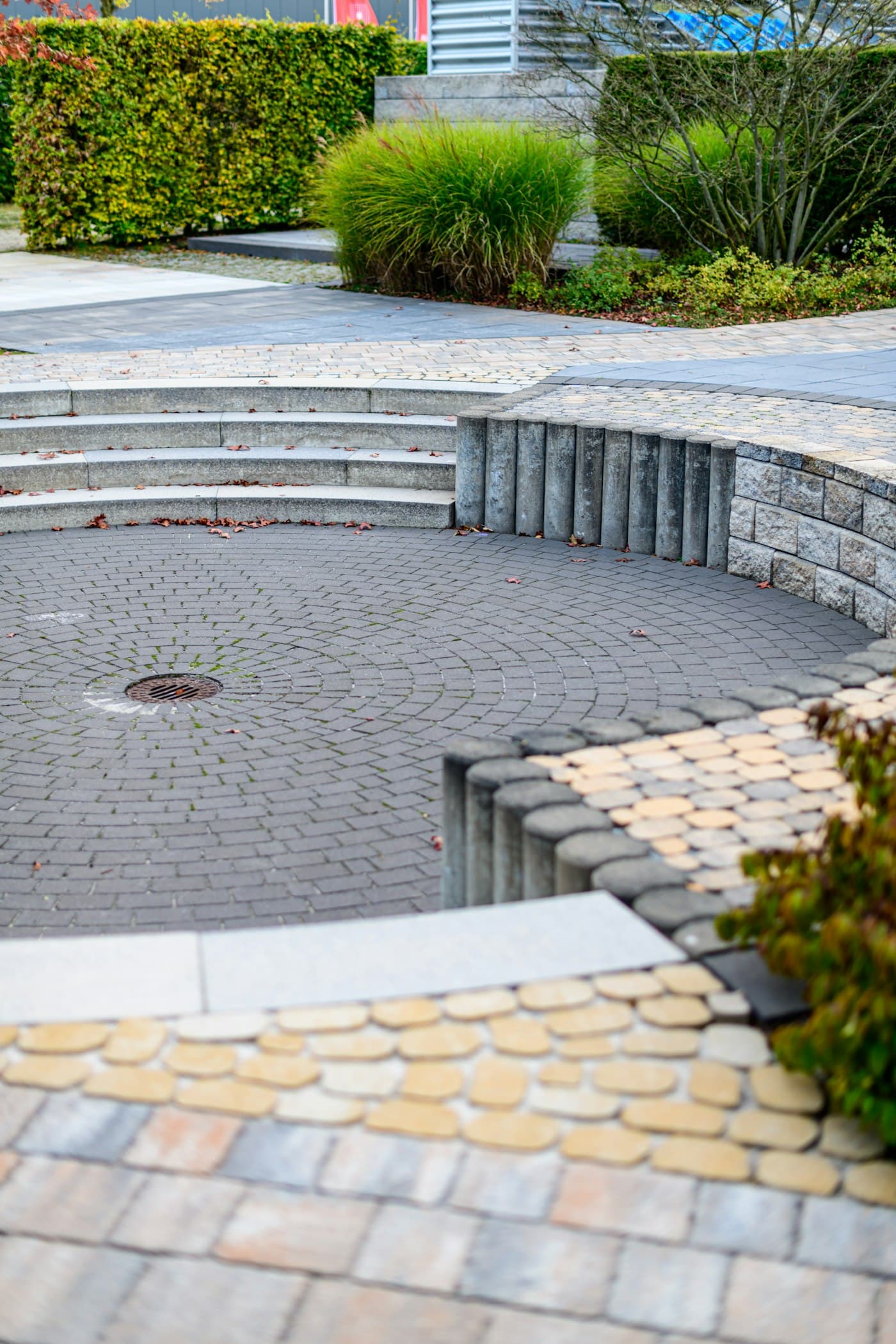 Curved paver seating area with stone steps