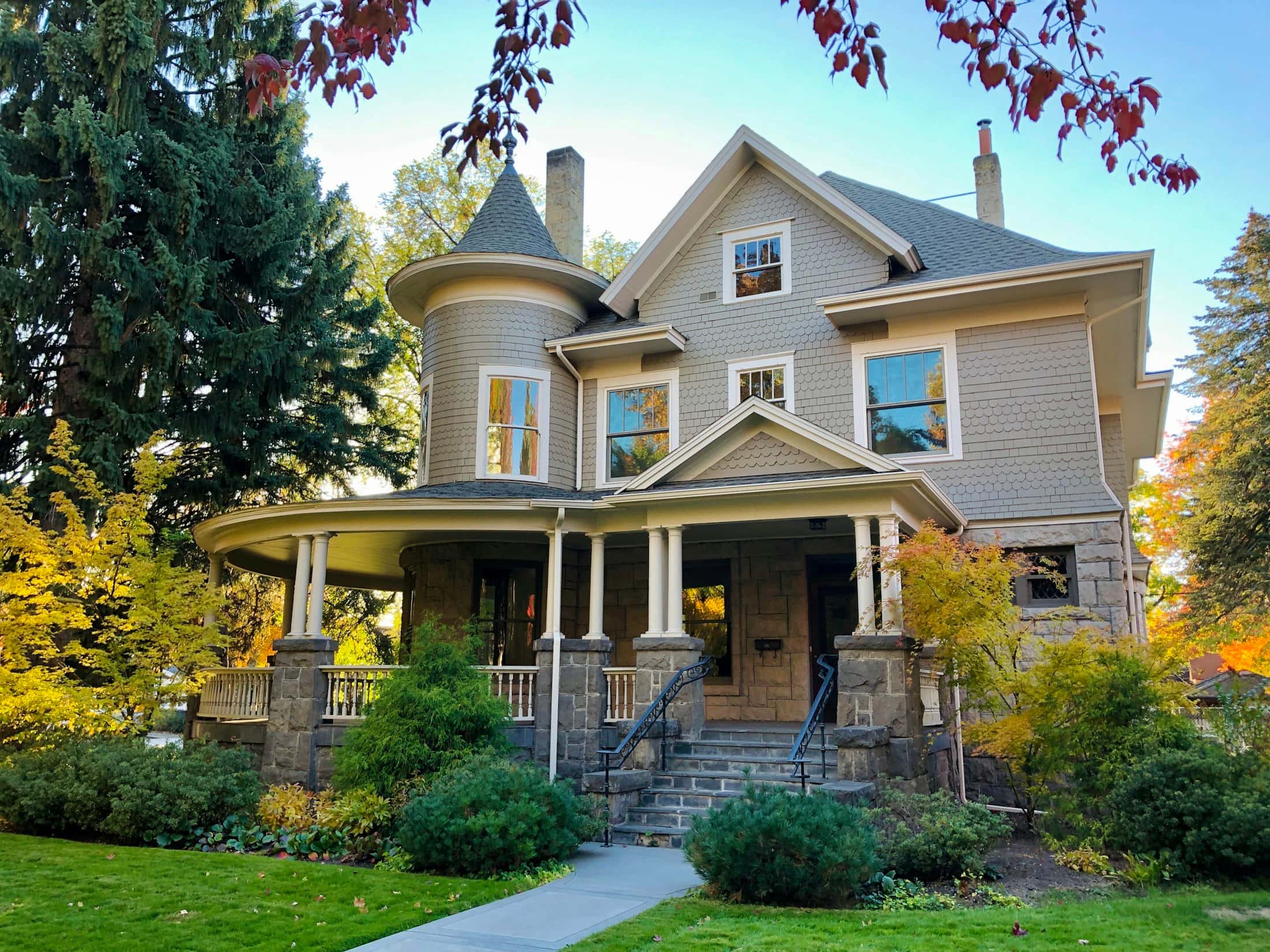 Beautifully restored home with stone steps, porch and landscaped yard