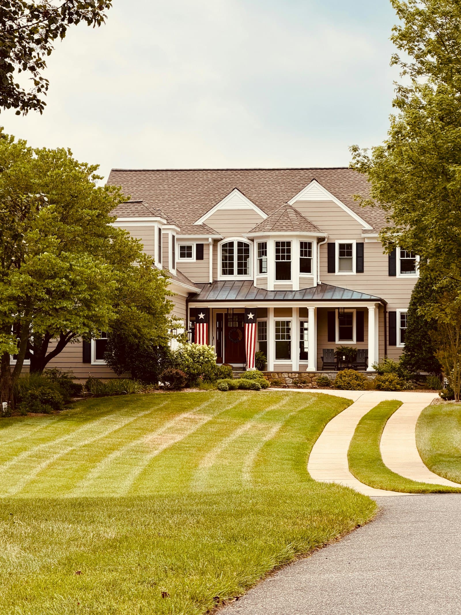 Curved driveway leading to a home