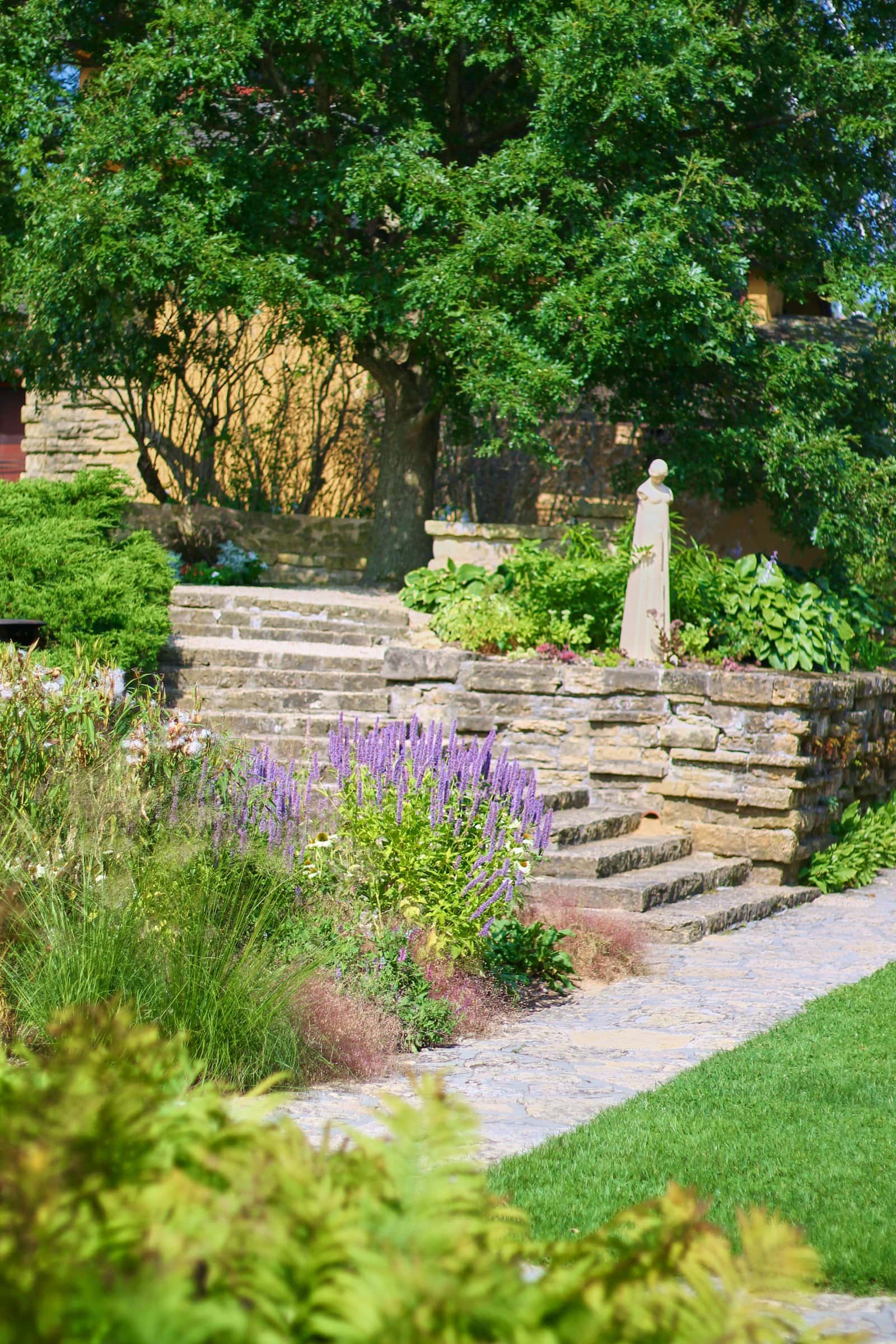 Natural stone steps and retaining walls in a landscaped garden